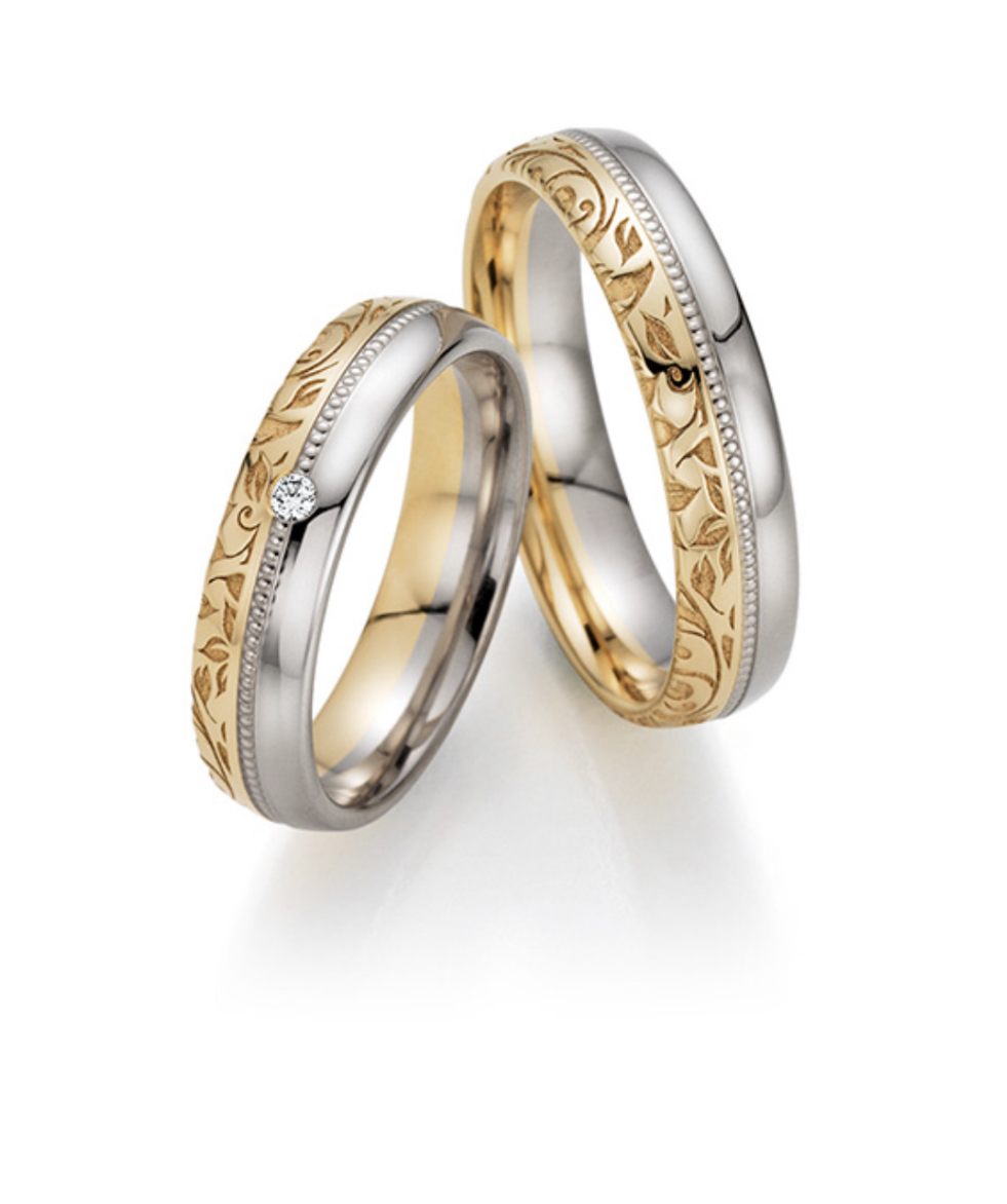 Обручальные кольца с бриллиантом(0,027 ct.) из платины и золота